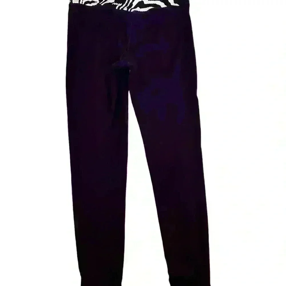 Nike Active pants size L in purple and green.